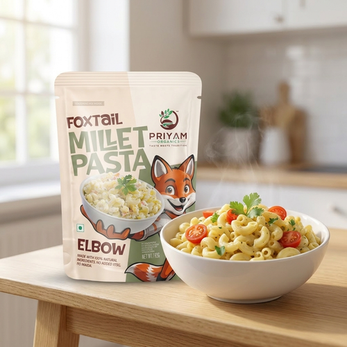 Foxtail millet elbow macaroni cooked in creamy masala, served beside the pack